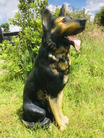 herders  hond zittend polyester beeld 